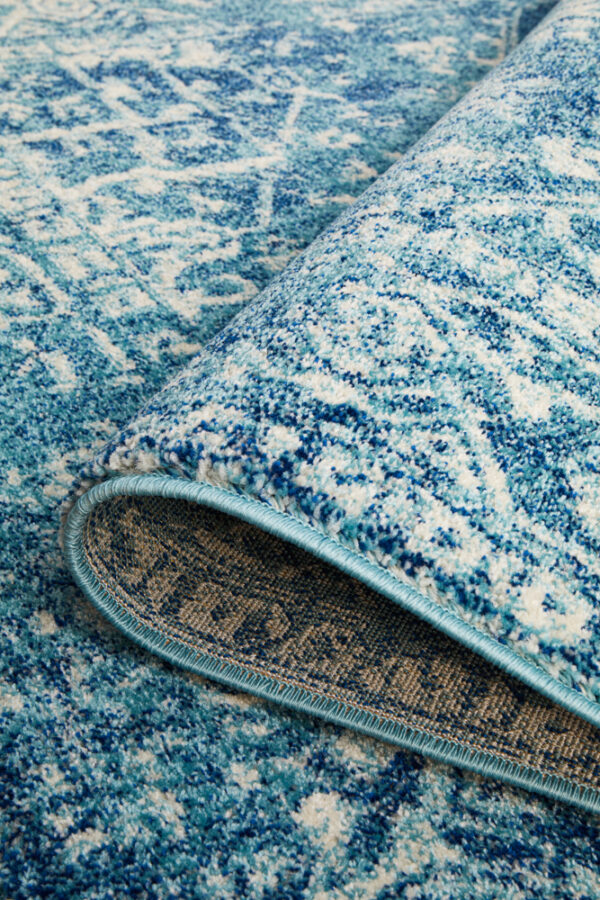 Faded Blue Area Rug Floded over