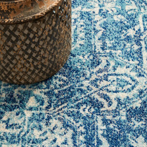 Faded Blue Area Rug Pot on the rug