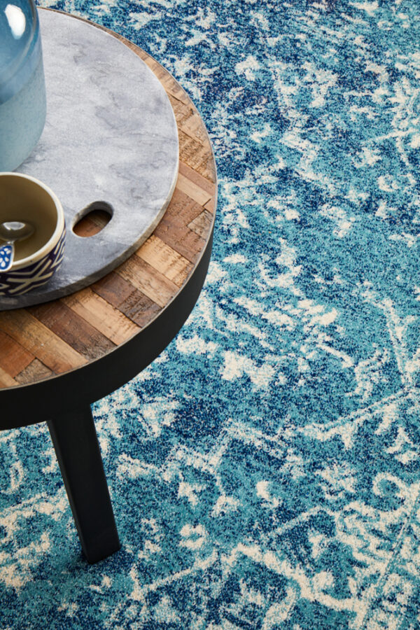 Faded Blue Area Rug Table on rug