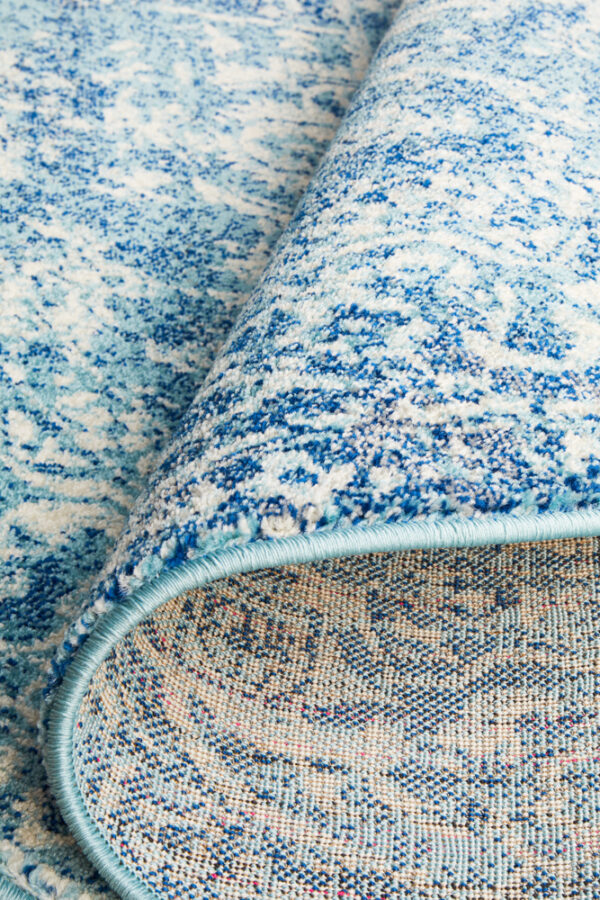 Faded Blue Area Rug round backing