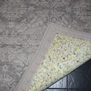 Premium Rug Underlay now stuck to back of rug.