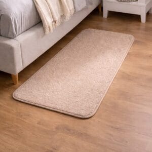 beige-indoor-carpet-mat-beside-bed-in-bedroom.jpg