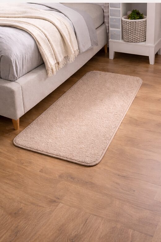 beige-indoor-carpet-mat-beside-bed-in-bedroom.jpg