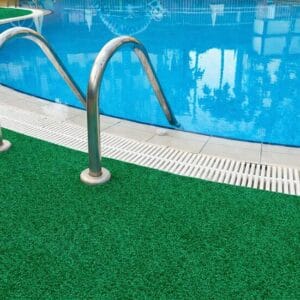 Green marine carpet installed around swimming pool area in Australia