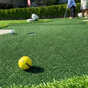 Green marine carpet used on outdoor mini golf putt putt course