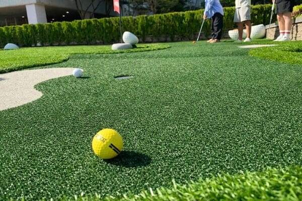 Green marine carpet used on outdoor mini golf putt putt course